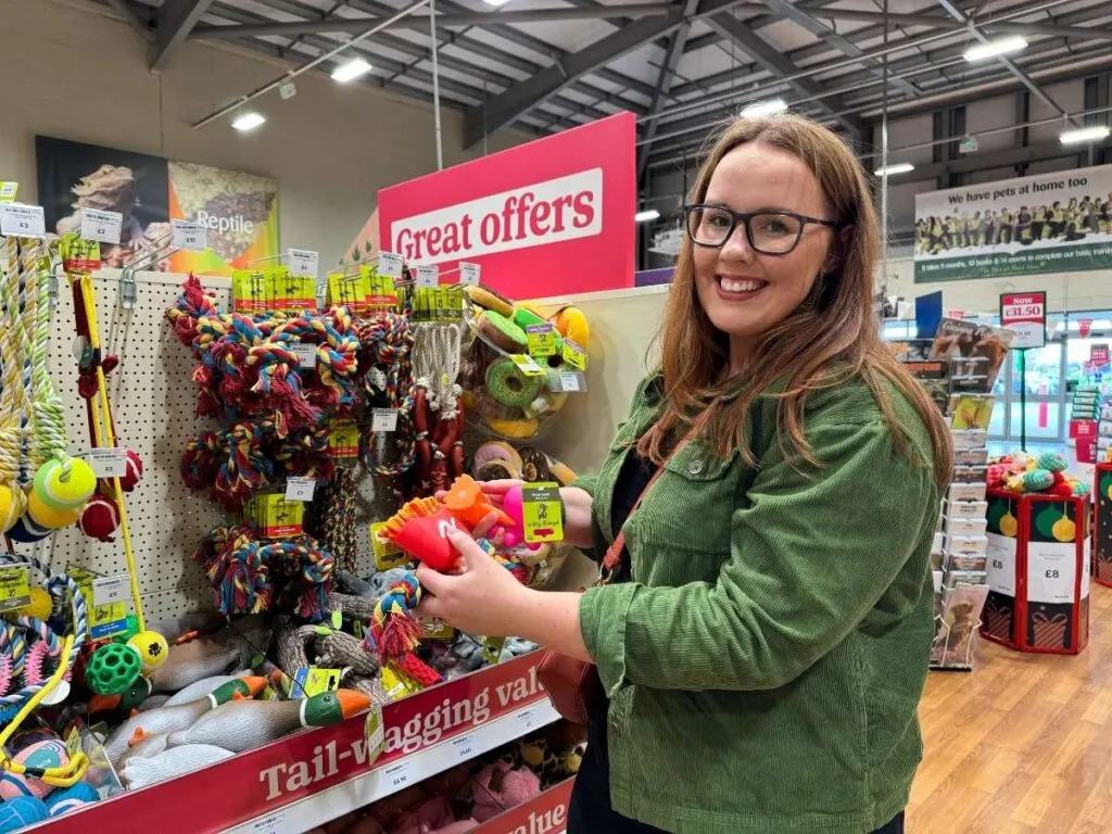 Chloe from Chloe's Deal Club in Pets at Home holding £1 toy savings deal