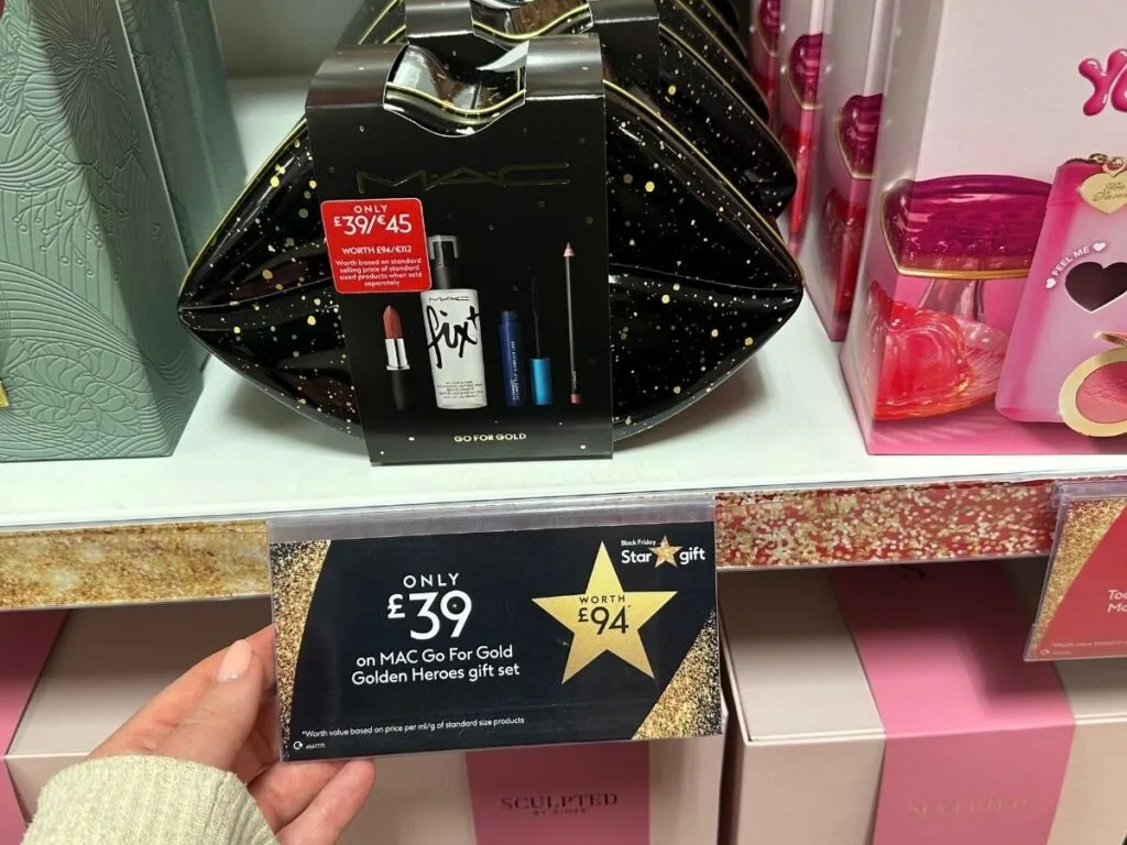 Chloe's hand holding the Boots star gift to save money when you shop at Boots