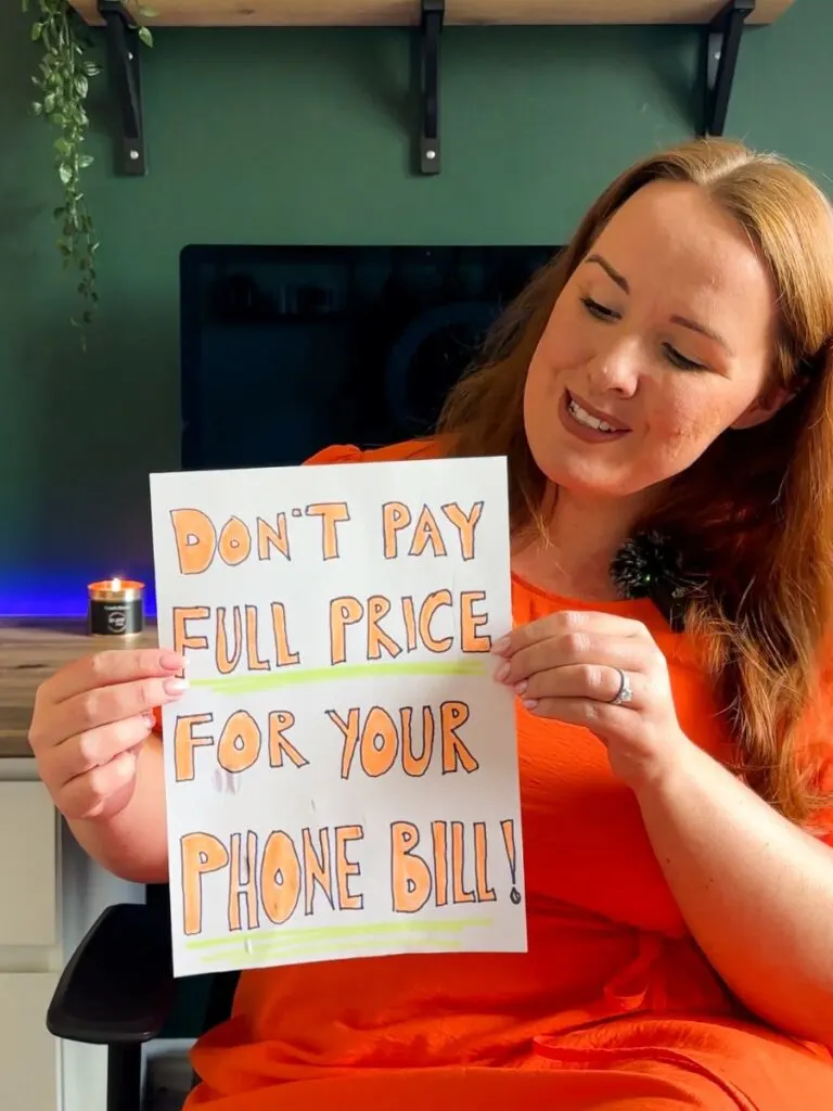 chloe of chloe's deal club holding a piece of paper about airtime rewards app saying don't pay full price for your phone bill