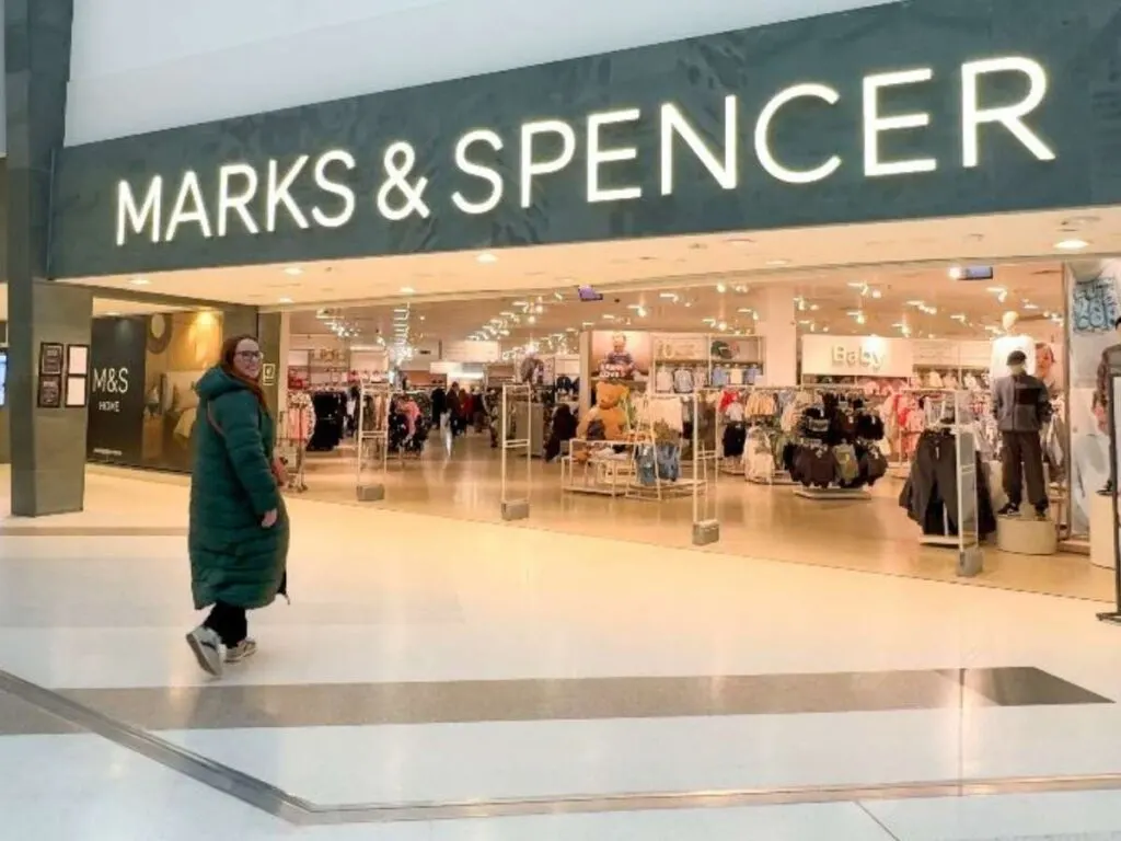 Chloe walking into Marks and Spencer showing you how to save money when shopping