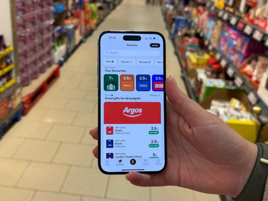 A mobile phone displaying the Cheddar app showing how to save money by using cashback with gift cards