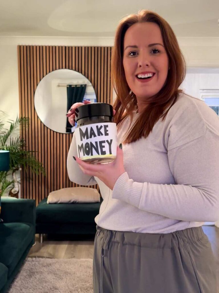 Chloe holding a money box to show earning money whilst you shop online using JamDoughnut cashback app