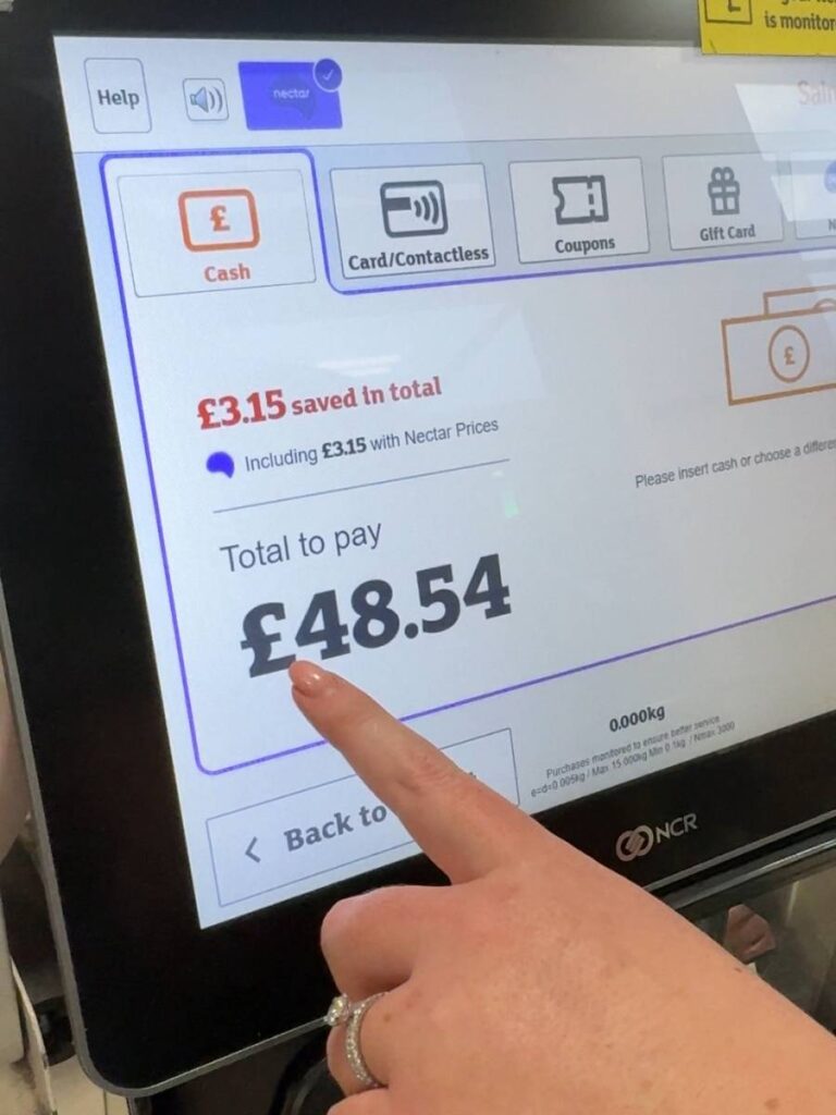 A hand showing options to pay with gift card at Sainsburys and how to save money