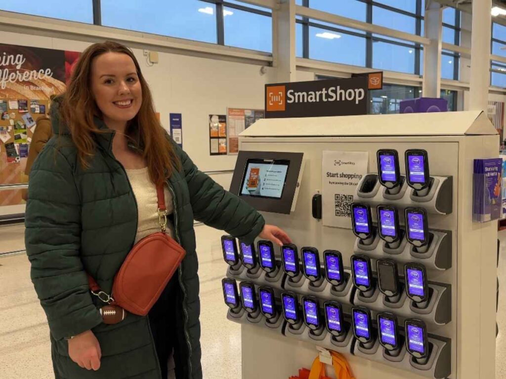 Chloe of Chloe's deal club standing next to Smart shop scan in Sainsburys to save money whilst shopping