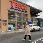 Chloe walking into Tesco to show how to save money on your weekly shop