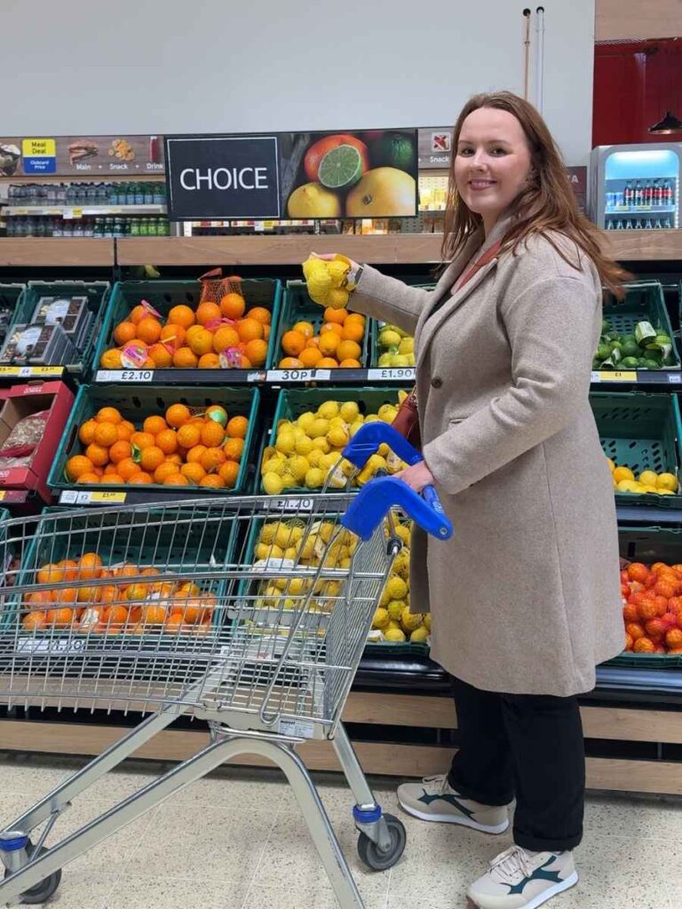 Chloe in Tesco showing how to save money by shopping online or in store