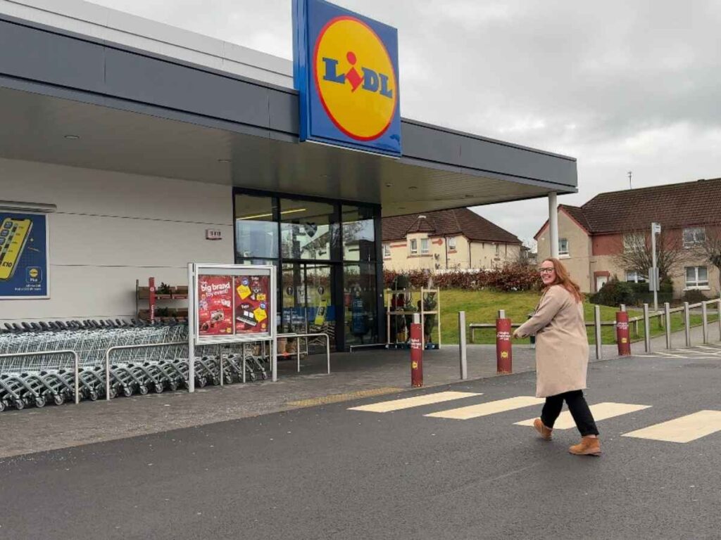 Chloe walking into a Lidl supermarket to show you how to save money at your weekly shop