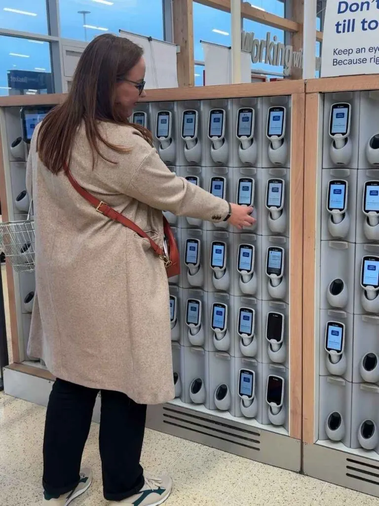 Chloe standing next to the Tesco scan as you shop which is a great tip to save money at Tesco during your weekly shop