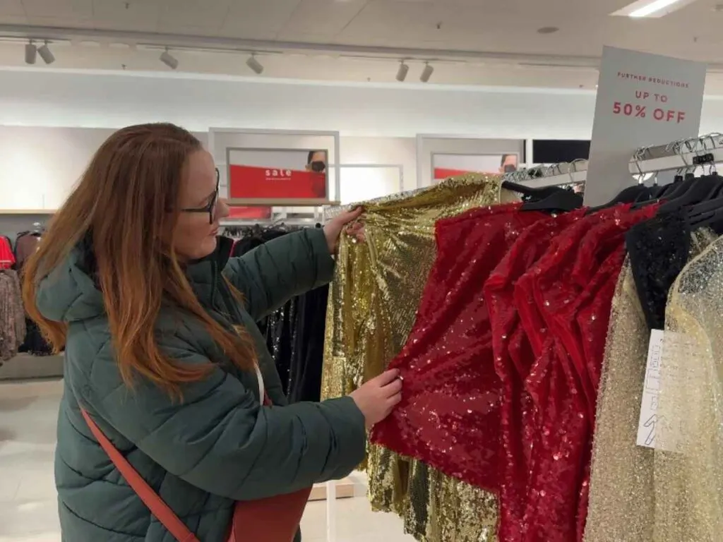 Chloe looking at the range of outfits discounted in the Marks and Spencer sales